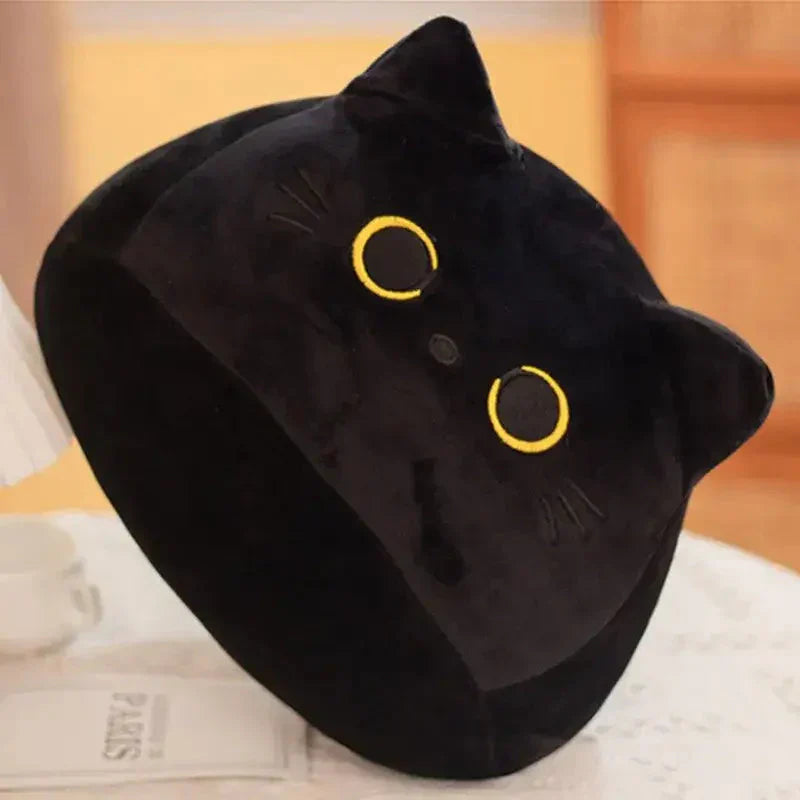 Peluche Chat ininterrompue - Oreiller de tête de chat noir sur le lit | Peluche Chat